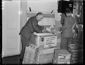Correspondence School staff pack materials for exhibition