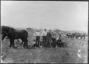 Group of men standing in a paddock with a team of horses, Willow Park, Masterton