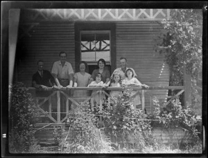 Group of people on a verandah, Mangamahu