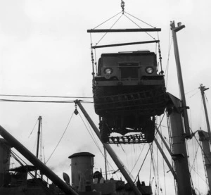 Lorry being lifted by a crane on to a ship during World War 2
