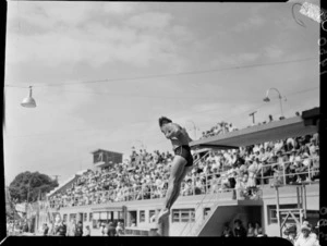 Male diver mid-air during a dive, 1950 British Empire Games, Auckland