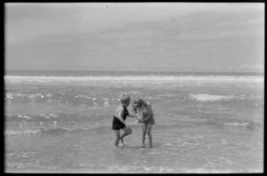 Ray and Margaret Hare playing in the surf