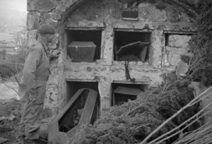 View of vaults at a cemetery that were damaged by shell fire in Italy during World War II