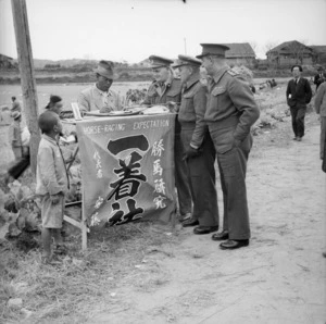 NZEF in Japan - Capt. C Cook (Whangarei), Major J M Wilson (Christchurch), Major E C Mathews (Auckland) at a small race meeting at Ozuki (Chofu)