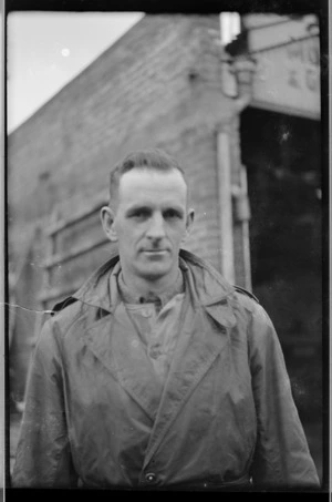 Man at premises of Coutts Bros and Hare Ltd, Willis St, Wellington