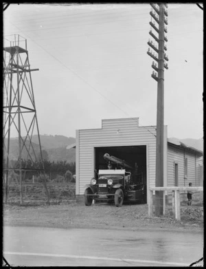 View of the new fire station on the Hutt Road at Silverstream, with the fire engine in the doorway, 1938