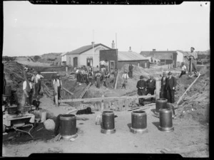Workers laying drainage pipes near the General Store, Castlecliff, Wanganui
