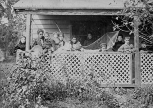 Chorlton, A F :Photograph of Wallace family on the verandah of their house at Otaki
