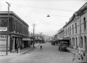 Looking down Jackson Street, Petone, with the businesses of W V Wilson & Co and the Victoria Hotel in the foreground
