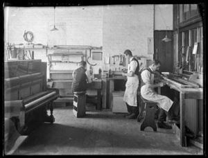 Returned servicemen repairing musical instruments at the Bristol Piano Company, Christchurch