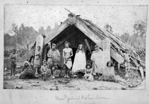 Maori family outside a whare puni, Mangaakuta, near Masterton