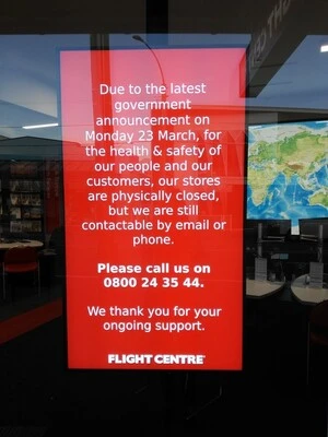 Digital photograph of COVID-19 signage at Flight Centre, Newtown