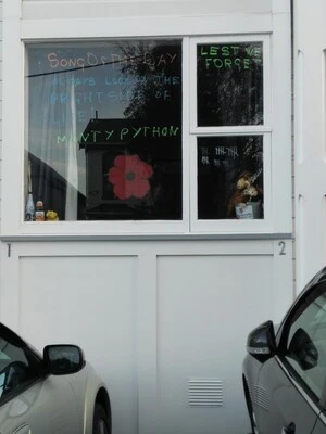 Digital photograph of COVID-19 and ANZAC Day signage at a house on Hall Street, Newtown