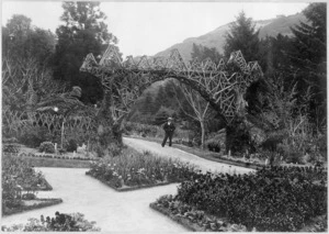 Unidentified man near arch, Wellington Botanic Garden