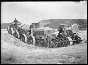 Tractor, wagons and workers at a cement works on Limestone Island, Whangarei