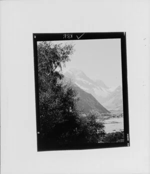 Valley with snow covered mountain in background