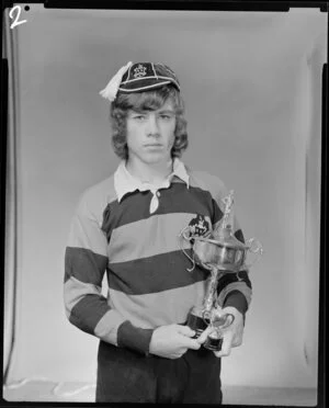 Mr Henderson with sporting trophy
