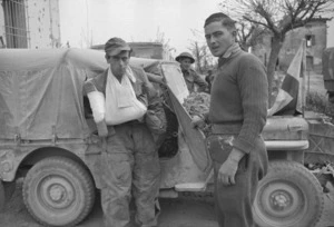 Wounded German prisoner entering a New Zealand Red Cross truck, Sesto Imolese, Italy