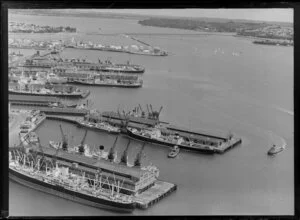 Auckland wharves at the time of arrival of the Royal Yacht Britannia, shown in the distance