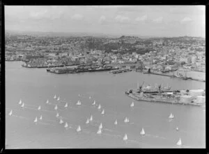 Auckland city wharves at the time or arrival of Royal Yacht Britannia, with flotilla of yachts