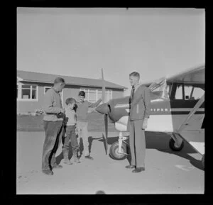 Two men and two boys with Piper aircraft, Mid Canterbury Aero Club, Ashburton