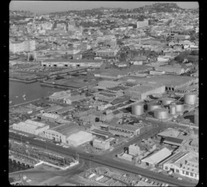 Auckland waterfront with tank farm and showing premises of John Shaw (NZ) Ltd, wine and spirit merchants