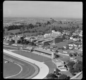Race track and housing scenes in Auckland with One Tree Hill in the background