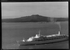 The passenger ship Canberra on Waitemata Harbour, Auckland, with Rangitoto Island in the background