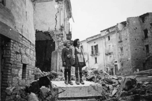 Children standing atop ruins of the demolished village of Gessopalena, Italy
