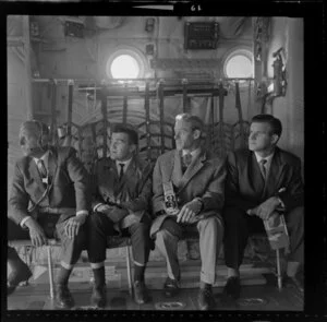 Four Men sitting inside Lockheed Hercules, Whenuapai Airport, Waitakere, Auckland