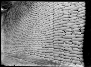 Chelsea Sugar Refinery, Birkenhead, Auckland, showing piles of sacks in raw sugar store