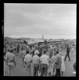Crowds inspecting an aeroplane, Royal New Zealand Aero Club pageant, Ardmore