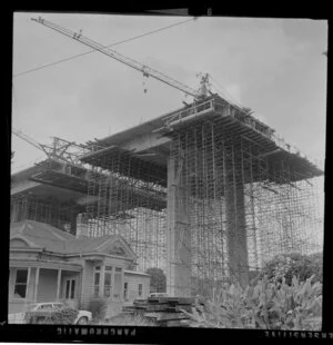 Construction of southern motorway viaduct from Clovernook Road, Newmarket, Auckland, including house used as site office