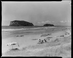 Sun-bathers and swimmers on Whangamata beach, Thames-Coromandel District