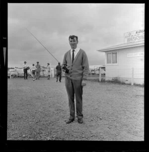 Unidentified man with walkie-talkie, Royal New Zealand Aero Club pageant, Ardmore