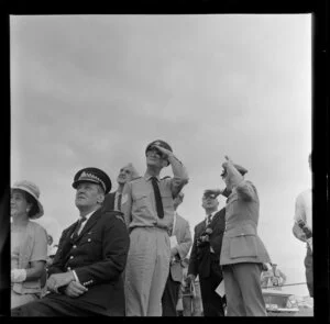 Spectators gazing at the sky at the Royal New Zealand Aero Club pageant, Ardmore