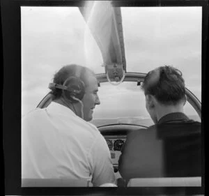 Pilot and passenger inside the aeroplane, Royal New Zealand Aero Club pageant, Ardmore