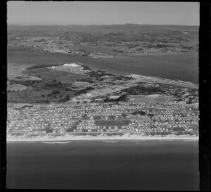 Upper Tauranga Harbour, with site of fertilizer works prominent, surf beach in foreground