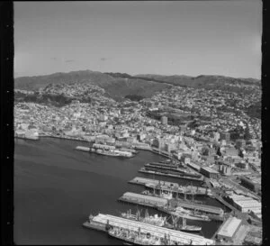 Wellington, including wharves with ships alongside and city buildings