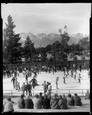 Crowd at skating rink, Queenstown with The Remarkables in the background