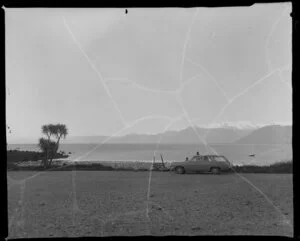 Holden station wagon and family at Jackson Bay, Westland