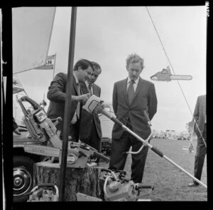 Member of Parliament, Duncan McIntyre, being shown an Echo chainsaw