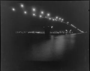 Lights on Auckland Harbour Bridge at night, taken from Fisherman's wharf restaurant