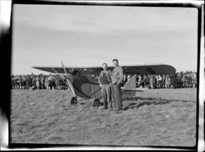 Bristol Freighter tour, Christchurch, D N Shaw and Charlie Savage standing by the Parasol monoplane