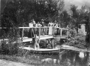 Group on wooden foot bridge