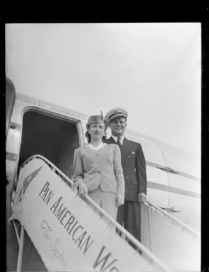 Unidentified air hostess with L Tomas, Pan American World Airways