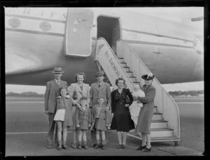 Mr and Mrs Manson and family standing by the Clipper Malay, Pan American World Airways