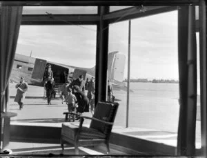 Passengers disembarking from aircraft, Harewood Airport, Christchurch