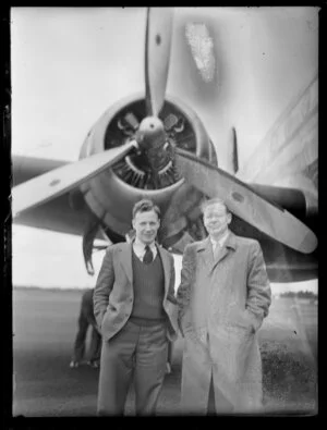 Fred Ried [Reid?] and Mr A Jones standing under the propellor of the Pan American Airways aeroplane