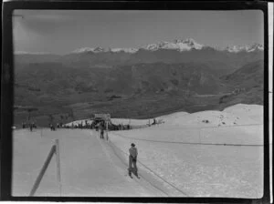 Skiers using Coronet Peak tow